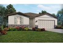 Charming single-Gathering home with stone accents, an attached garage, and a lush, landscaped front yard at 1859 Draughton Dr, Zephyrhills, FL 33541