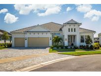 Beautiful single-story home with a two-car garage, neutral color scheme, and manicured landscaping at 4754 Manning Ct, Sarasota, FL 34240