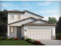 Charming two-story home features a large garage, neutral paint, stone accents, manicured lawn, and beautiful landscaping at 3921 Radiant Mountain Dr, Plant City, FL 33565