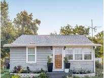 Charming one-story home featuring a gray exterior and a well-maintained front yard at 1426 Erie S St, St Petersburg, FL 33712