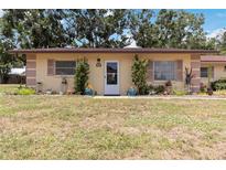 Charming one-story home with beautiful flower beds and manicured lawn at 4549 Tippecanoe Trl # 20, Sarasota, FL 34233
