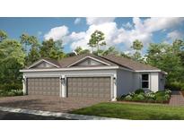 Charming single-story home featuring a two-car garage, well-manicured landscaping, and a welcoming facade at 3142 Torta Ct, Bradenton, FL 34211