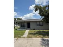 Charming single-story home featuring a covered porch, well-maintained lawn, and neat landscaping at 845 18Th S Ave, St Petersburg, FL 33705