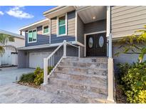 Charming two-story home with a welcoming entrance and well-maintained landscaping at 328 6Th Ave, Indian Rocks Beach, FL 33785