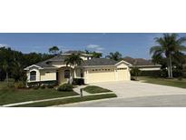 Charming home with a well-manicured lawn, lush landscaping, and a spacious three-car garage at 10937 Bluestem Cir, Lakewood Ranch, FL 34202