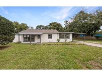Charming single-story home with a covered front porch and carport at 103 4Th Nw Ave, Lutz, FL 33548