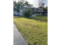 Spacious two-story home with a large yard, deck, and detached garage at 4713 9Th E St, Ellenton, FL 34222