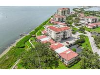Beautiful waterfront condos with manicured lawns, lush landscaping, and a tranquil view of the water at 6218 Palma Del Mar S Blvd # 103, St Petersburg, FL 33715
