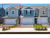 Charming townhome with a well-maintained front yard and attached one car garage at 42850 Park View Dr, Punta Gorda, FL 33982