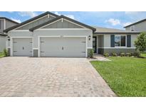 Charming single-Gathering home with a well-manicured lawn and an inviting two-car garage at 1806 Draughton Dr, Zephyrhills, FL 33541