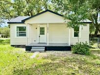 Charming single-story home featuring a covered front porch and well-maintained yard at 38706 8Th Ave, Zephyrhills, FL 33542