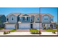 Charming townhomes featuring varied exterior colors, attached garages, and well manicured landscaping at 42862 Park View Dr, Punta Gorda, FL 33982