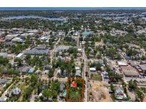 An aerial view shows the home's location amid the neighborhood with convenient access to nearby shops and roadways at 226 N Grosse Ave, Tarpon Springs, FL 34689