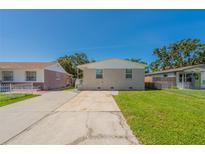 Charming single-story home with a well-manicured lawn and a spacious driveway at 3850 11Th S Ave, St Petersburg, FL 33711