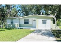 Charming single-story home with fresh paint, tidy landscaping, and a concrete driveway at 2731 Union S St, St Petersburg, FL 33712