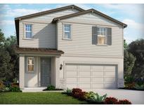 Charming two-story home with a two-car garage, landscaped yard, and stylish gray accents at 1844 Brekey Way, Zephyrhills, FL 33541