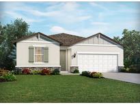 Charming one-story home showcasing stone accents, neutral siding, a two-car garage, and a beautifully landscaped front yard at 450 Sun Chaser Dr, Nokomis, FL 34275