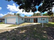 Charming single-story home with an attached garage and well-maintained front yard at 2813 21St W Ave, Bradenton, FL 34205