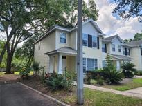 Charming two-story townhome with a manicured front yard and a welcoming entrance at 2247 Golden Oak Ln, Valrico, FL 33594