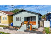 Charming home featuring a gray exterior, newly renovated front porch and welcoming curb appeal at 2904 Sanchez St, Tampa, FL 33605