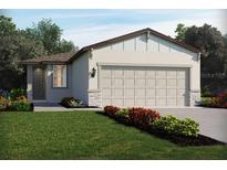 Charming single-story home with a two-car garage, landscaped yard, and stone accents at 14126 Crutchfield Ct, Parrish, FL 34219