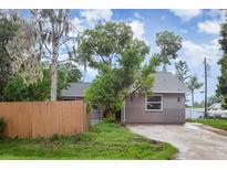 Quaint single-story home featuring a new roof, neutral paint, and a well-maintained front yard with mature landscaping at 4358 Murdock Ave, Sarasota, FL 34231