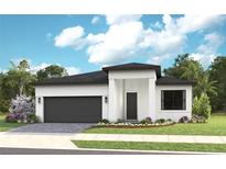 Modern home showcasing a clean white facade, dark roof, complemented by a well-manicured lawn and landscaping at 14375 Hammock Oak St, Parrish, FL 34219