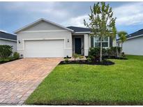 Charming single-story home with well-maintained landscaping and a brick driveway at 3567 74Th Avenue E Cir, Sarasota, FL 34243