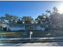 Charming single-story home with a cozy covered parking space and a neatly maintained front yard at 3036 Dixie Ave, Sarasota, FL 34234