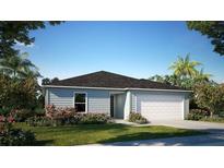 Charming single-story home with a well-manicured lawn and attached two-car garage at 14037 Canada Goose Rd, Brooksville, FL 34614