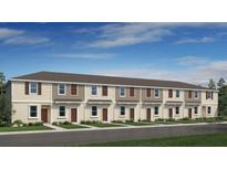 Charming townhome showcases a welcoming exterior with a well-manicured lawn and multiple front doors at 14052 Textile Run, Parrish, FL 34219
