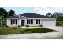 Charming one-story home with a well-manicured lawn and a two-car garage at 12422 Convent Garden Rd, Brooksville, FL 34613