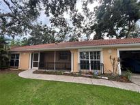 Charming single-story home with a well-maintained lawn and a tile roof, perfect for comfortable living at 131 49Th E Ct, Palmetto, FL 34221