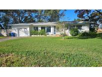 Single story house with attached garage at 1432 S Keene Rd, Clearwater, FL 33756