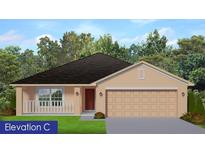 Charming single-story home featuring a two-car garage, covered porch, and neutral color palette, nestled among lush trees at 4529 Sutherland St # Lot 4, Spring Hill, FL 34609