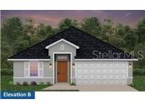Charming single-story home with a gray exterior, a dark roof, and an attached two-car garage at 4537 Sutherland St # Lot 3, Spring Hill, FL 34609
