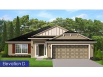 Charming single-story home featuring a neutral color scheme, prominent garage, and well-manicured lawn at 4881 Sutherland St # Lot 54, Spring Hill, FL 34609