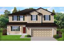 Charming two-story home with neutral siding, dark shutters, and a spacious two-car garage at 4848 Sutherland St # Lot 60, Spring Hill, FL 34609