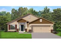 Charming single-story home featuring a symmetrical facade, a two-car garage and manicured front lawn at 4904 Sutherland St # Lot 66, Spring Hill, FL 34609