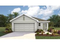 Charming one-story home featuring a covered entrance, two-car garage and complemented by lush landscaping at 30852 Wild Juniper Ct, Brooksville, FL 34602