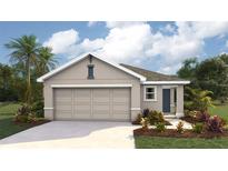 Charming single-Gathering home showcasing a two-car garage, landscaped yard, and attractive architectural design at 11783 Memorial Dr, Brooksville, FL 34613