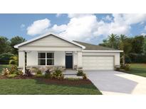Charming single-Gathering home with a two-car garage and well-manicured lawn, blending modern design with a touch of traditional style at 10411 Tucker Rd, Weeki Wachee, FL 34613