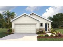 Charming one-story home with stone accents, a two-car garage, and lush landscaping at 10476 Tucker Rd, Weeki Wachee, FL 34613