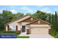 Charming one-story home boasts stone accents, a two-car garage, and a well-manicured lawn surrounded by mature trees at 4934 Sutherland St # Lot 69, Spring Hill, FL 34609