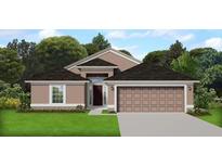 Charming single-story home featuring neutral paint, black roof, manicured lawn, and a spacious two car garage at 5461 Ocean Breeze Dr, Spring Hill, FL 34609