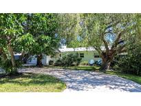 Charming single-story home with a circular driveway at 1479 S Evergreen Ave, Clearwater, FL 33756