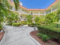Beautiful courtyard with tropical landscaping and multiple levels in a condominium complex at 2700 Bayshore Blvd # 3210, Dunedin, FL 34698