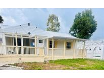 Charming single-story home featuring a spacious porch and well-maintained landscaping at 3620 E Tampa Cir, Tampa, FL 33629