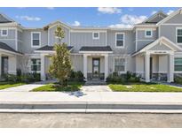 Charming townhomes boast craftsman details, welcoming entrances, and manicured landscaping at 7424 Cabin Ln, Sarasota, FL 34240