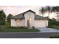 One-story home with a two-car garage and landscaped yard at 228 Vistera Blvd, North Venice, FL 34275